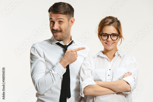 The business man and woman communicating on a gray background