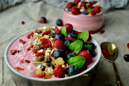 Smoothie Bowls with  Granola,Raspberries, Blueberries,Goji Berries and Mint.Healthy Breakfast