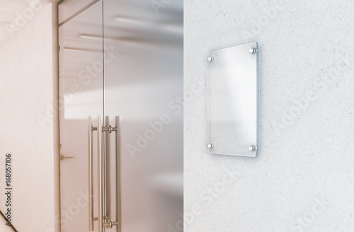 Blank vertical transparent glass sign plate mock up, 3d rendering. Nameplate mockup on the wall near office entrance interior. Signage panel, store door template. Clear printing framework for branding