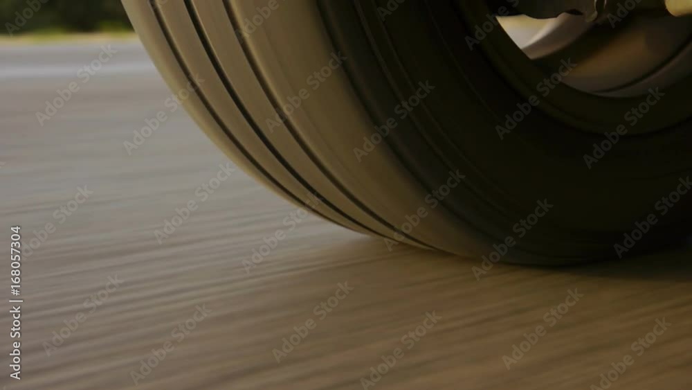 Car wheel spinning POV - Point of View, day country side. Close Up.