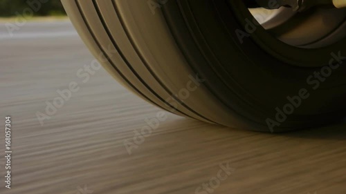 Car wheel spinning POV - Point of View, day country side. Close Up.