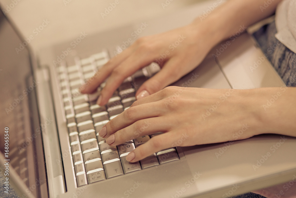 Close up view of woman hands keyboarding on laptop. Female working with computer, typing. Close up view of woman hands keyboarding on laptop. Female working with computer, typing.