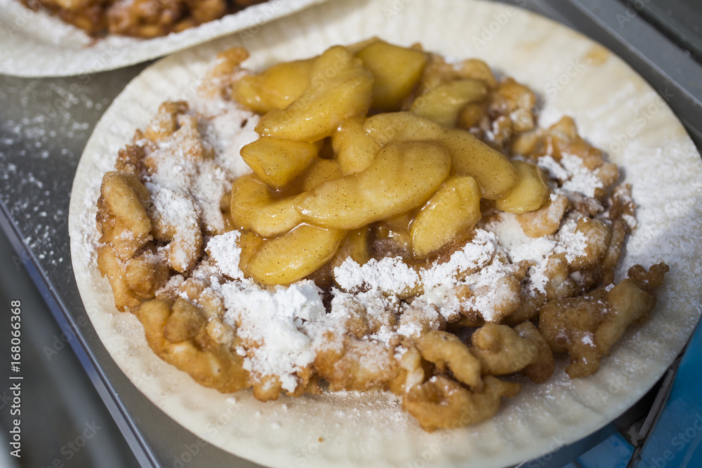 Funnel cake with apple topping in midway at the Indiana State Fair Funnel cake with apple topping in midway at the Indiana State Fair