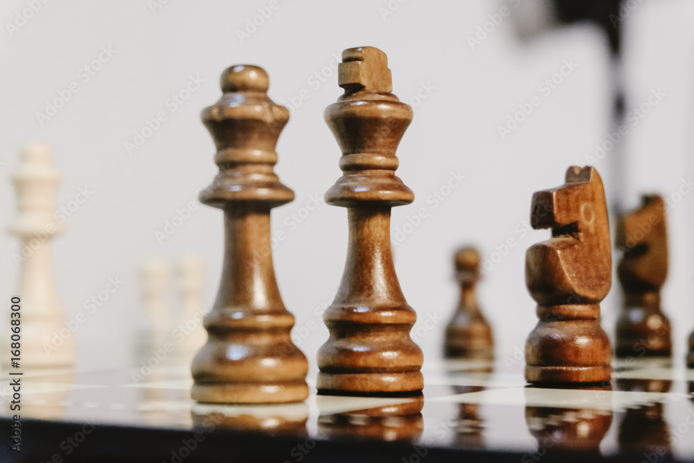 Business and leadership concept, king and queen as a leader.Chess pieces on board with reflection Business and leadership concept, king and queen as a leader.Chess pieces on board with reflection