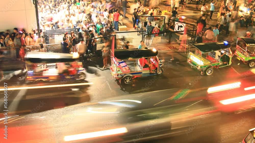 crowd of people walking with traffic jam at Siam center, Bangkok Thailand