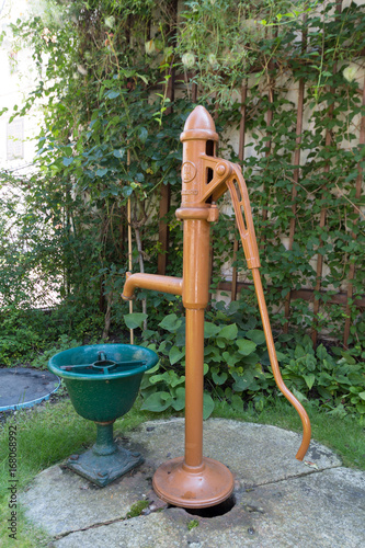 Old brown tap with drinking water