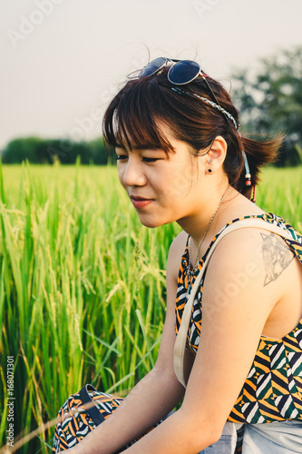 Portrait of young woman with green grass background. photo