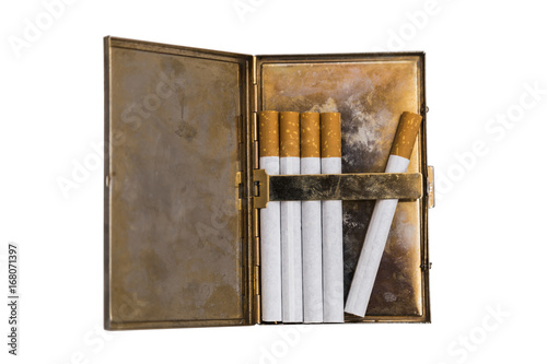 Fototapeta Naklejka Na Ścianę i Meble -  Metal vintage opened cigarette case with five cigarettes on isolated background.