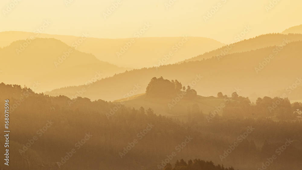 Outline of landscape in morning golden light. Saxon Switzerland, hill Krizak