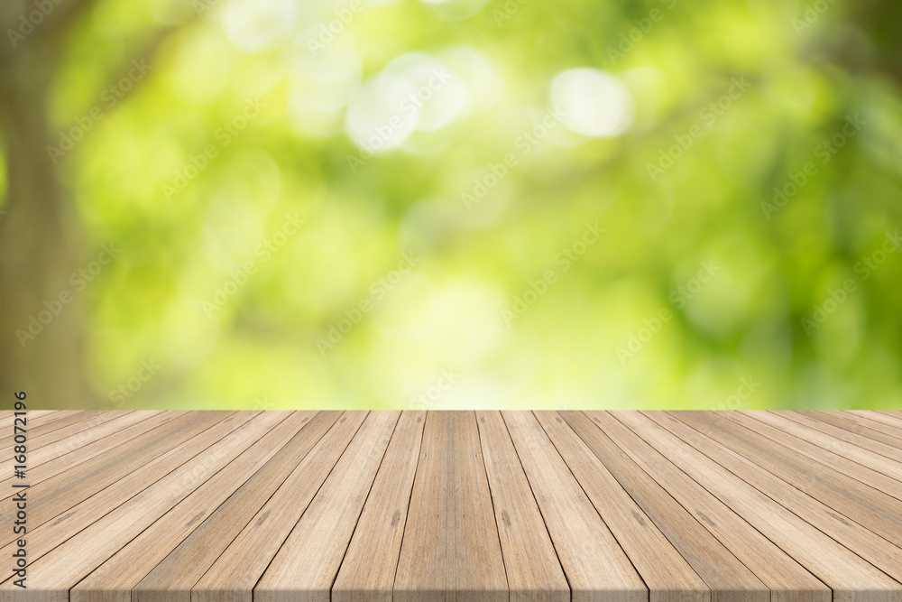 Empty wood table top on blurred abstract green background,Free space for editing products. Empty wood table top on blurred abstract green background,Free space for editing products.