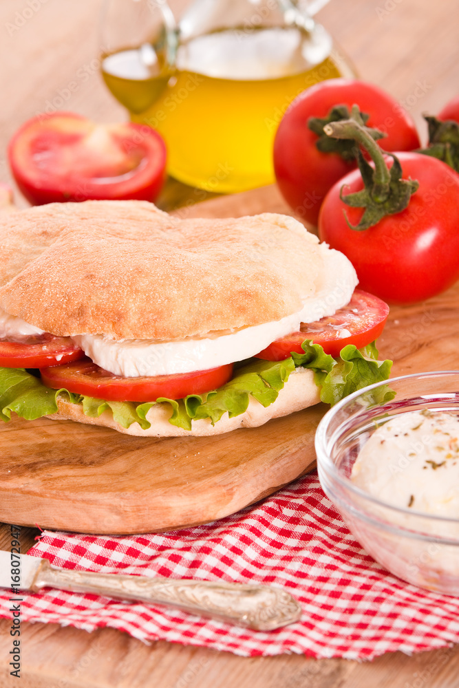 Puccia bread with mozzarella and tomato. Puccia bread with mozzarella and tomato.