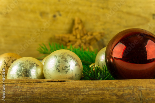 Christmas decoration with cinnamon starrn, Christmas balls and pine branch photo