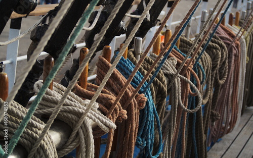 Marine ropes attached to rigging on deck of a tall ship