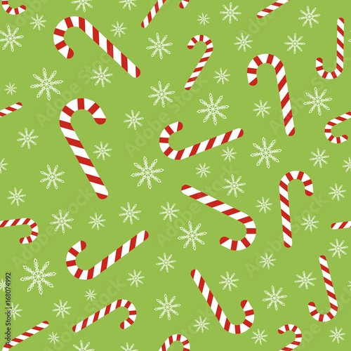 Christmas vector seamless pattern with candy canes and snowflakes