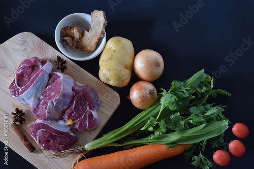 Fototapeta Naklejka Na Ścianę i Meble -  Beef on cutting board with ingredient prepare for soup.