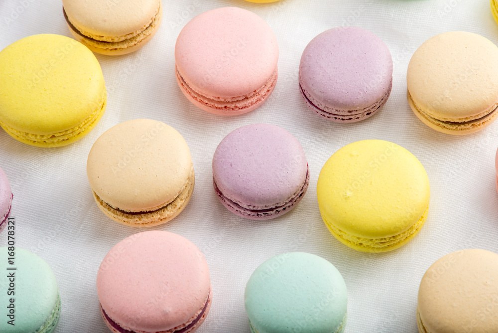 Colorful macarons on a white background. French dessert Colorful macarons on a white background. French dessert