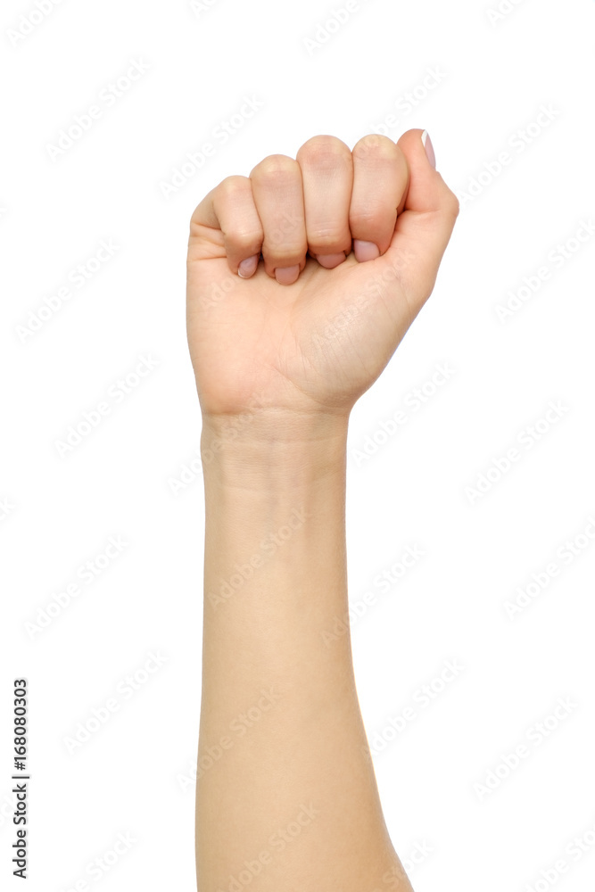 Female hand showing wrong fist gesture isolated on white Female hand showing wrong fist gesture isolated on white