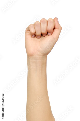 Female hand showing wrong fist gesture isolated on white photo
