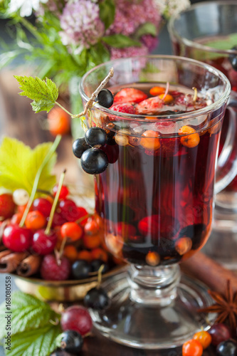 Herbal tea with berries  autumn healthy concept.