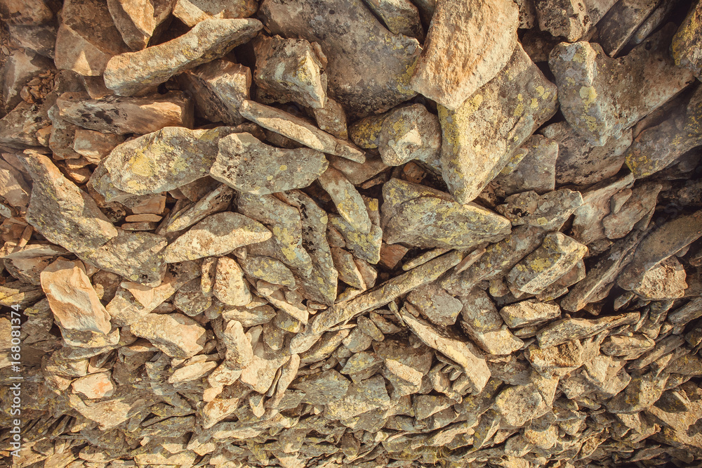 Abstract background with natural stone pieces. Texture of rocky mountains Abstract background with natural stone pieces. Texture of rocky mountains