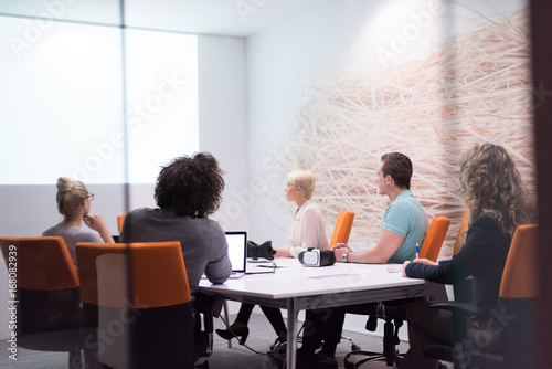 Startup Business Team At A Meeting at modern night office building