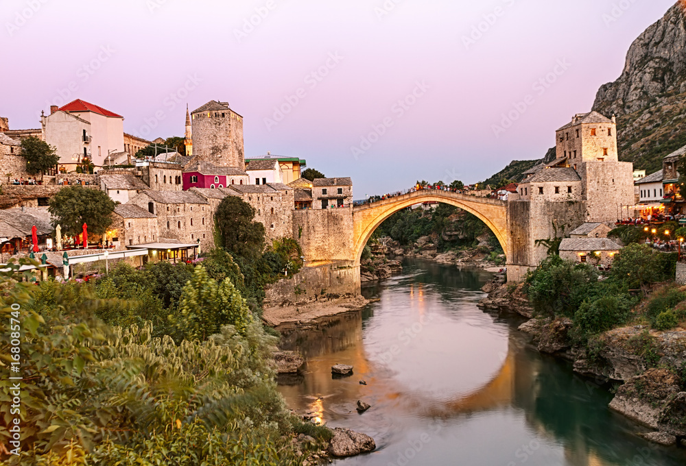 Old Bridge in the heart of the Old City of Mostar at golden hour, Bosnia and Herzegovina.