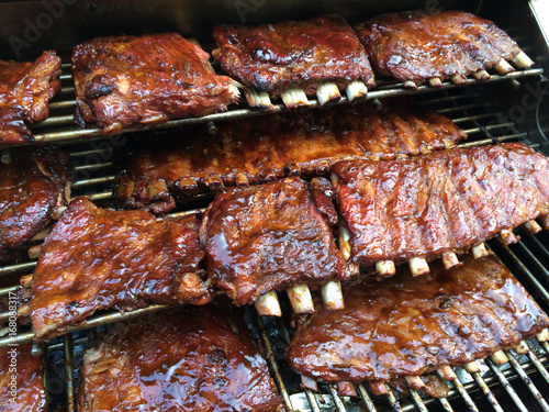 Fotografie Racks of BBQ Ribs on Memphis Woodfired Pellet Grill