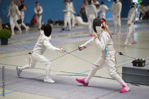 Girl and Boy fencing Foil at a tournament