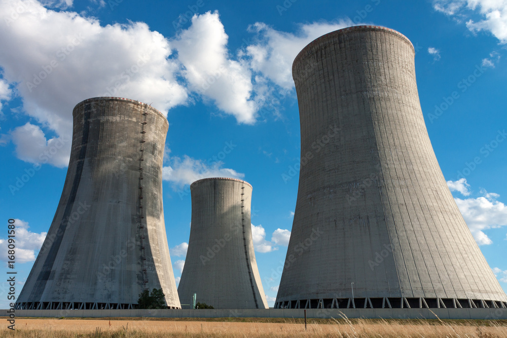 Nuclear power station, cooling towers against blue sky