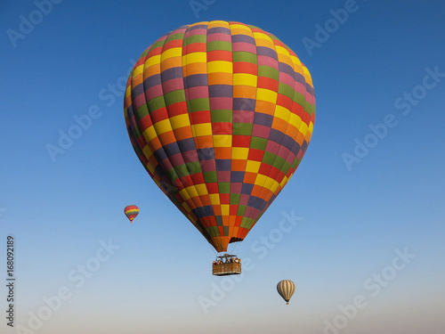 Hot air balloons against a clear blue sky