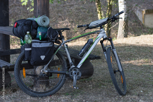 Mountain bike with saddlebags in the summer day.