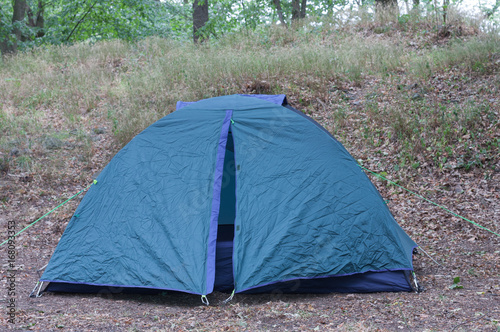 Tourist camping tent in the woods