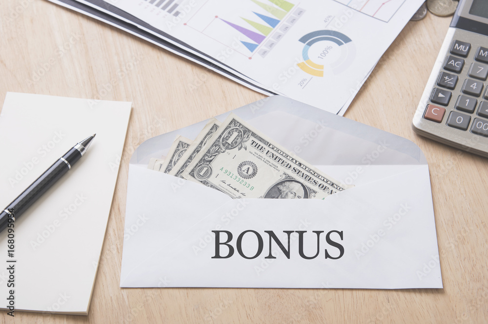 dollar money in the envelope on wood table. bonus, reward, benefits concept. dollar money in the envelope on wood table. bonus, reward, benefits concept.