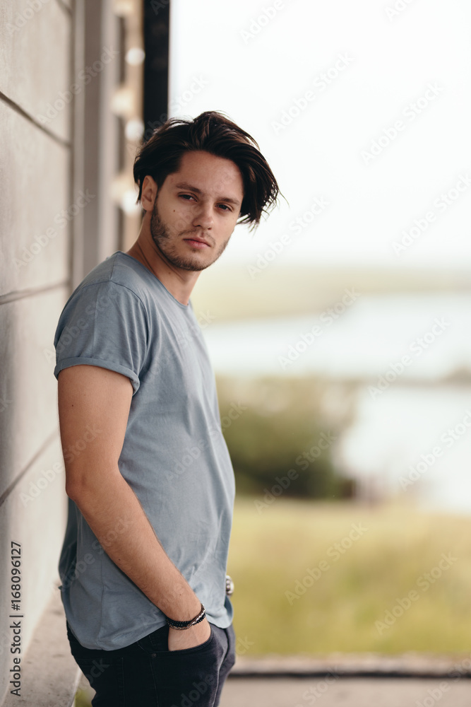 Young Caucasian Male Model Posing While Sitting Floor Studio Teenage Stock  Photo by ©veloliza 360430940