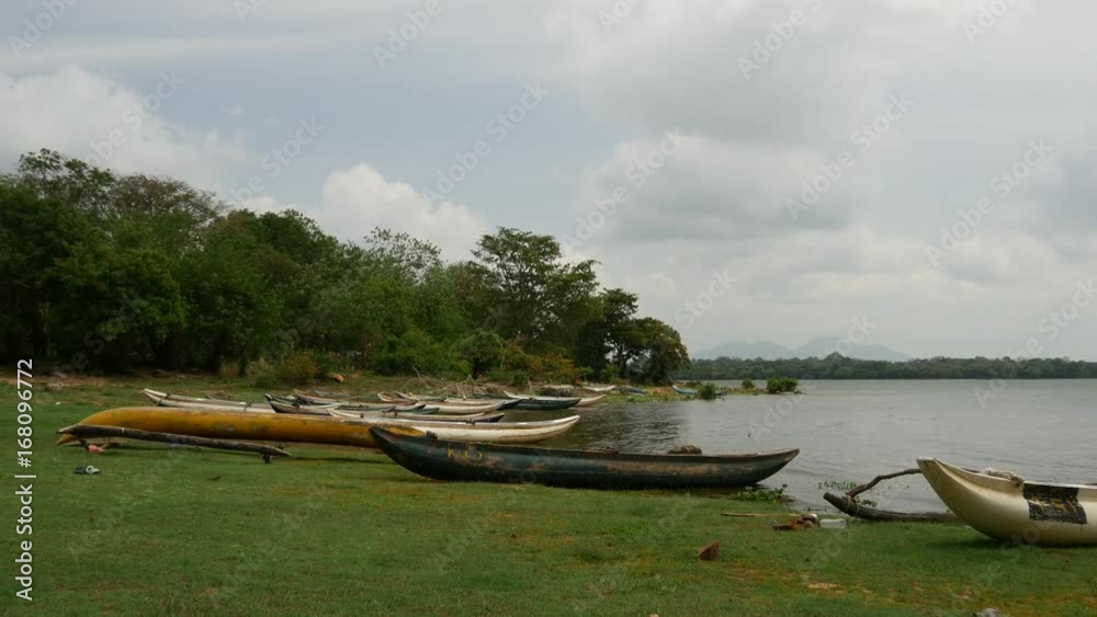 Small fishing boats at a lake in Anuradhapura District of Sri Lanka Small fishing boats at a lake in Anuradhapura District of Sri Lanka