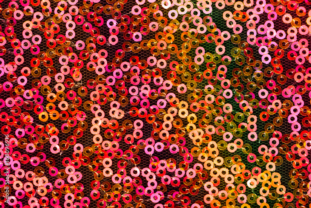 sequins pattern texture. Red, orange and pink round sequins background. sequins texture. sequins pattern texture. Red, orange and pink round sequins background. sequins texture.