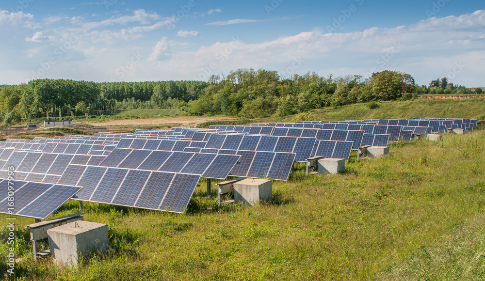 Solar panels on a field - sustainability theme Solar panels on a field - sustainability theme