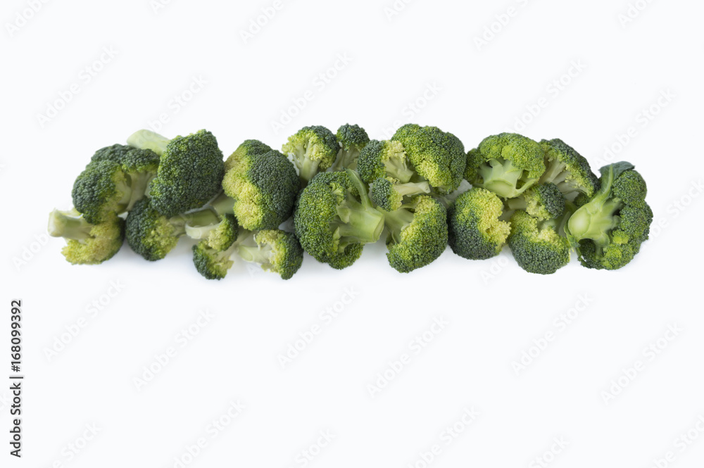 Broccoli at border of image with copy space for text. Broccoli isolated on a white background. Broccoli on white background. Top view. Broccoli at border of image with copy space for text. Broccoli isolated on a white background. Broccoli on white background. Top view.