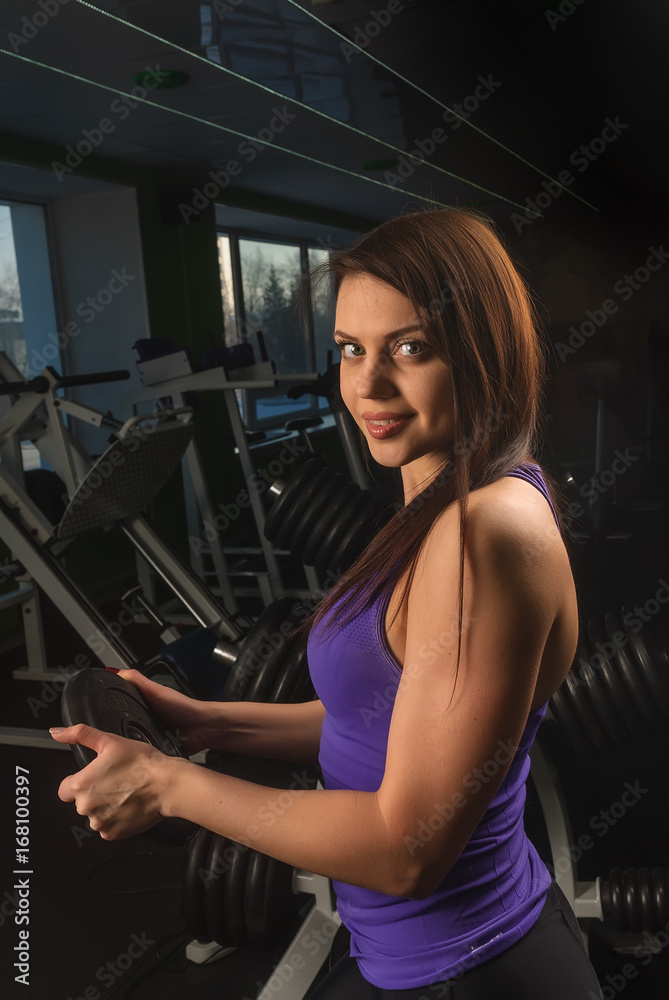 sexy young girl resting after dumbbells exercises. Fitness woman sexy young girl resting after dumbbells exercises. Fitness woman