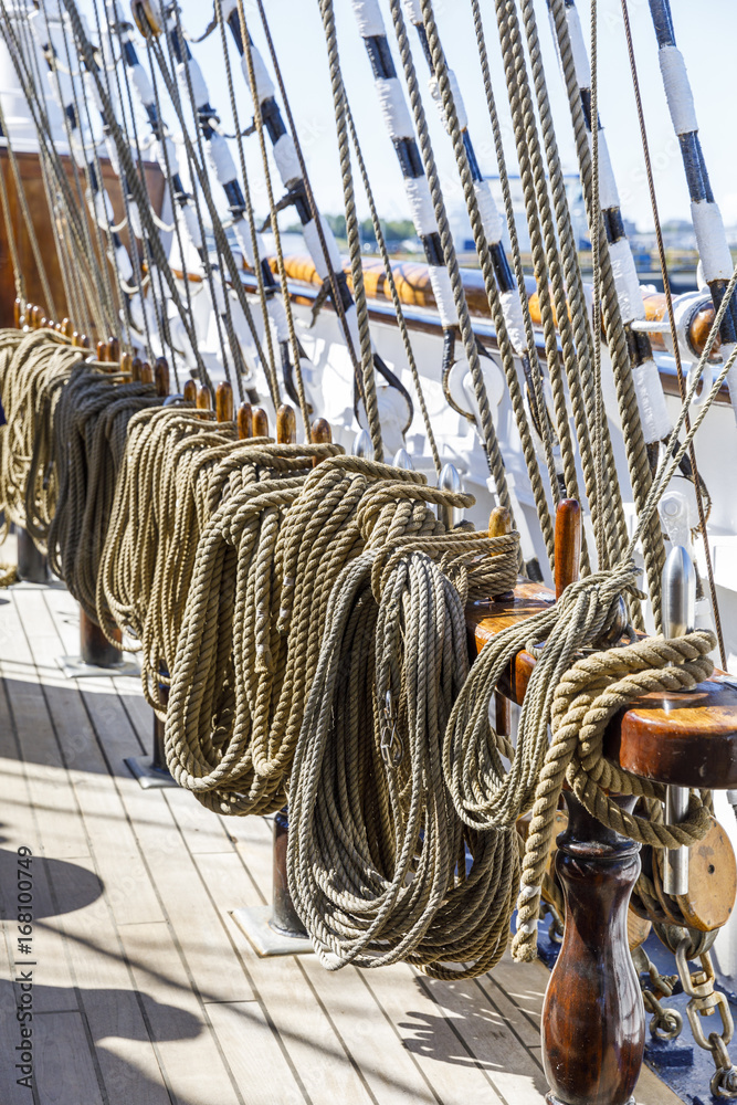 Obraz premium Many thick ropes bend together on a ship