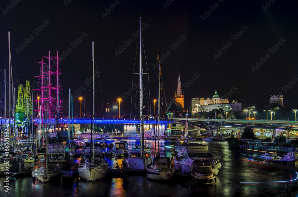 MARINA AT NIGHT - Yachts and sailing ship Mir moored at the wharf of the marina in Szczecin