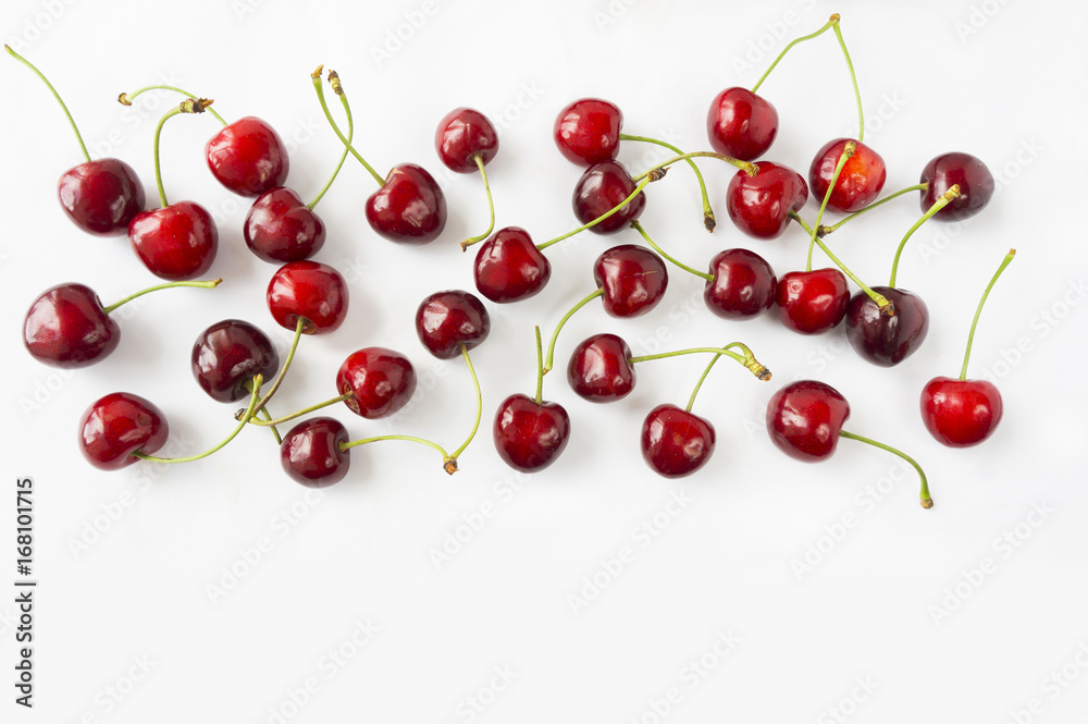 Ripe cherry on a white background. Cherries with copy space for text. Top view.