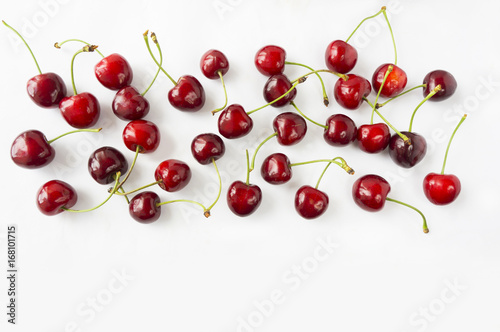 Ripe cherry on a white background. Cherries with copy space for text. Top view.