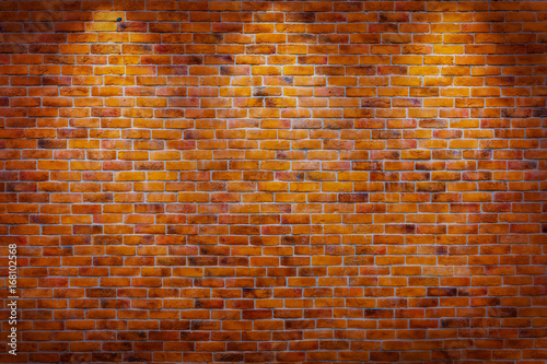 Vintage brick wall background with spotlights on the wall