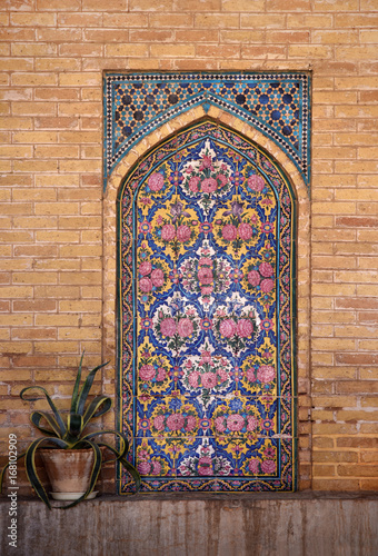 Decorative tiles on the facade at the entrance to the mosque Nasir ol-Mulk Mosque in Shiraz.  photo