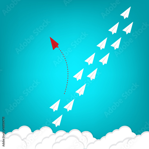 Minimalist stile red airplane changing direction and white ones. New idea, change, trend, courage, creative solution, innovation and unique way concept.