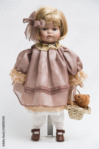 Ceramic porcelain handmade doll with blond hair and pink dress