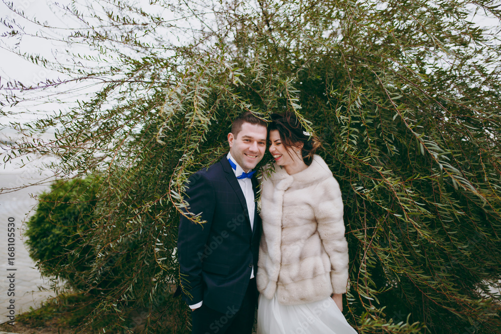 Beautiful bride and groom couple walking at the wedding Beautiful bride and groom couple walking at the wedding