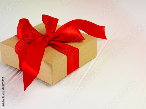 Christmas gift box with red bow and copy space