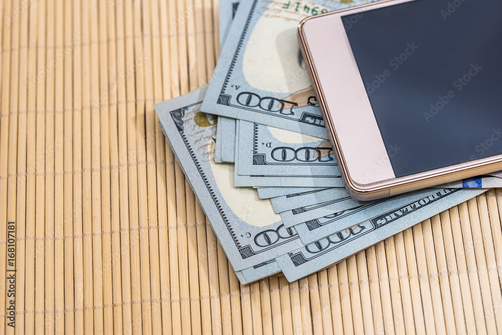 dollar banknote with phone. business concept dollar banknote with phone. business concept
